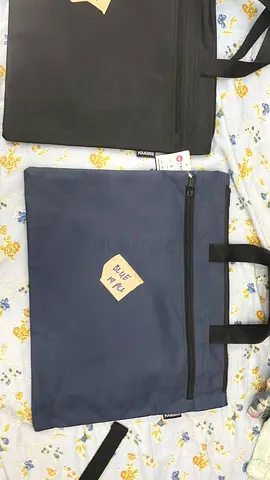 Two padded laptop bags / carrying cases (black  navy) - good condition