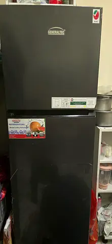 Used top-freezer refrigerator - black, good working condition