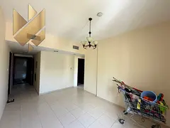 One-bedroom apartment with a living room overlooking Muwaileh Park, featuring free parking and one m