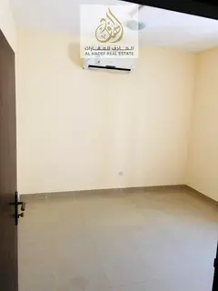 In Al Butinah, a one-bedroom apartment with a living room, two bathrooms, and split air conditioning