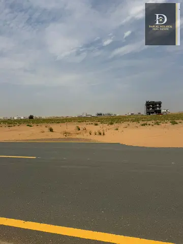 For Sale in Sharjah Rawdat Al Qurt Area Commercial Land in a Prime Location Close to all services Freehold for Arabs On a 152-meter street