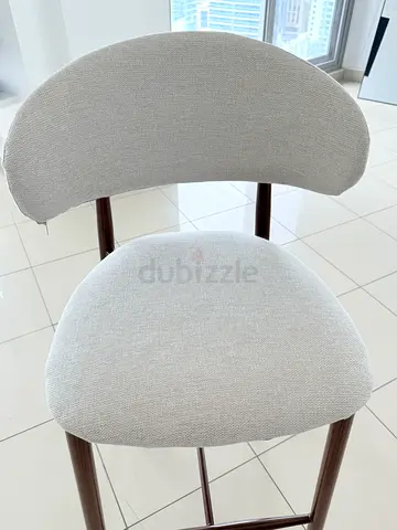 Set of 2 modern dining chairs with light grey upholstery and wooden legs