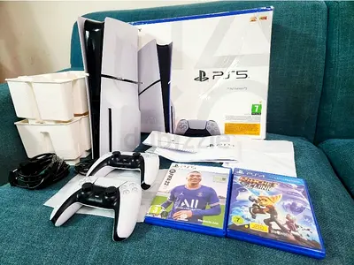 Playstation 5 Slim Disk 1 TB storage 2 original controllers and Games (Underwarranty)