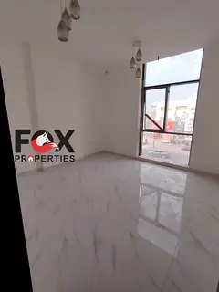 3BR hall in Al Rawda 3 on Sheikh Ammar Rd, balcony open view, central AC, prime location near Dubai