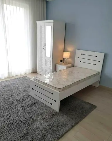 Selling brand new bed with mattress with cabinet