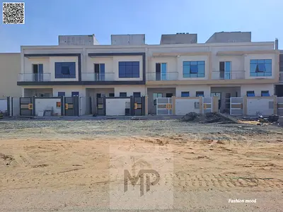 Townhouse(on a main road)|large front setback of 20 meters|ajman|al helio2|5 master rooms, majlis, hall, maid room, roof|freehold|0 registration fees.