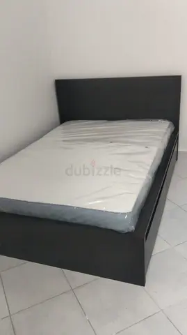 Ikea Double bed frame with headboard and mattress - dark wood finish