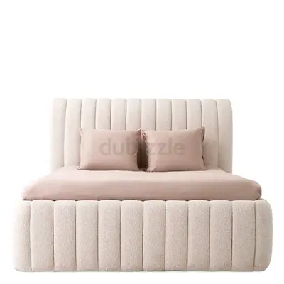 Cream upholstered double bed with tufted padded headboard and base