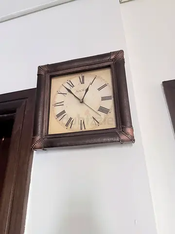 Vintage-style square wall clock with leather-look frame and Roman numerals