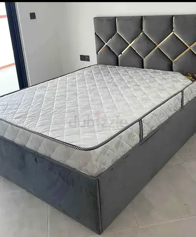 Grey upholstered bed frame with mattress - good condition