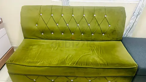 Green Velvet Two-Seater Sofa Bed with Button-Tufted Back