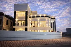 Modern villa on a corner lot with a large setback, garden, and roof terrace. Price includes registra