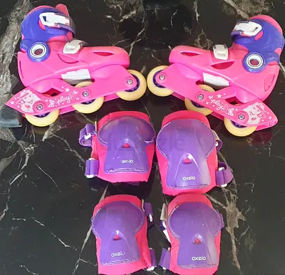 Girls pink  purple Oxelo inline skates with protection pads - size 25-29