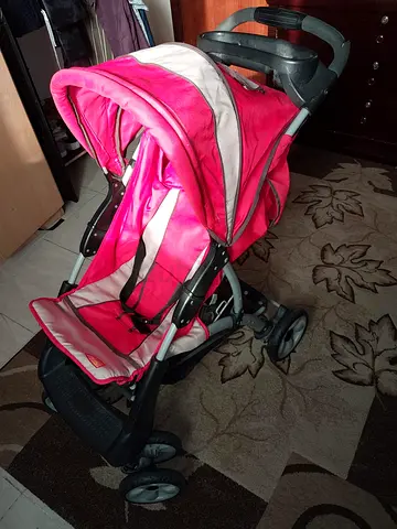 Lightweight red baby stroller - compact fold, good condition