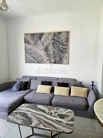 Grey L-shaped Sectional Sofa with  Coffee Table and Wall Art