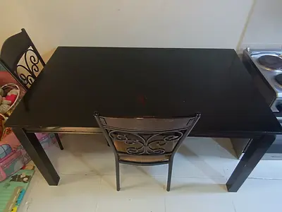 Classic Solid black dining table with 4 -back chairs - great condition