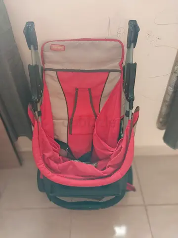 Lightweight red baby stroller - compact fold, good condition
