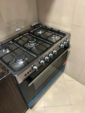 Used stainless steel 5-burner gas range with oven. In flawless condition.