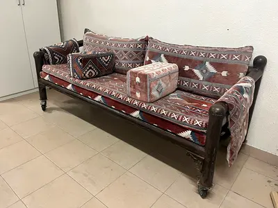 Iron sofa (Arabic seating) with wheels for easy movement.