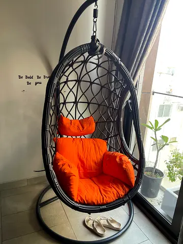 Black Rattan Egg Swing Chair with Orange Cushions and Stand