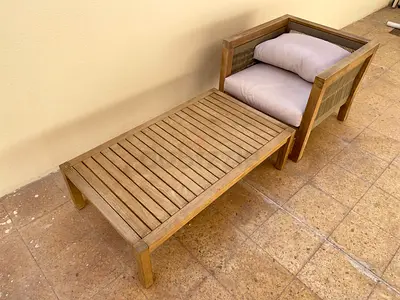 Outdoor wooden lounge chair with matching footrest — solid teak look