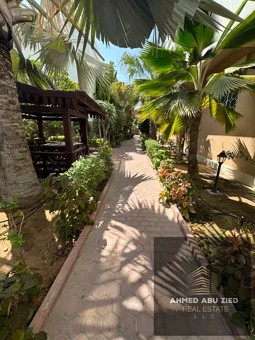 With free parking and a kids' area, a two-bedroom apartment with a living room is available for annual rent in Sharjah, in Al Khan, near the Corniche