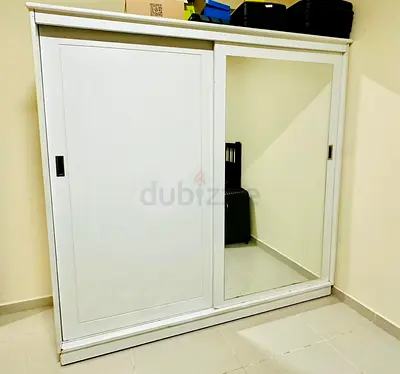 A 2-door compact sliding wardrobe with a mirror
