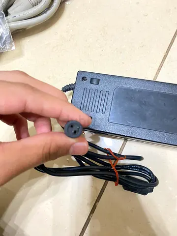 Universal power adapter / charger brick with round two-pin DC plug