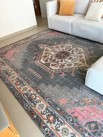 Large vintage-style oriental rug in grey with pink accents from West Elm
