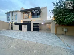 A luxurious villa with an elegant design, featuring 5 master bedrooms, a stylish majlis, and two lou