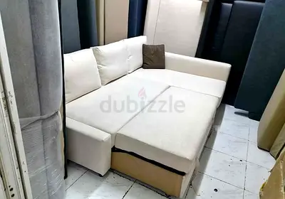 cream L-shape sofa bed with storage - good condition