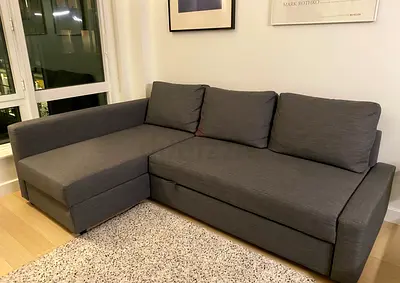 Grey L-shape sofa bed with storage Ikea model FRITHEN