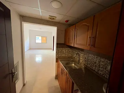 New studio apartment with a semi-detached kitchen for annual rent in Al Jurf 2, Ajman, behind Delta Centre, close to the National School and Universit
