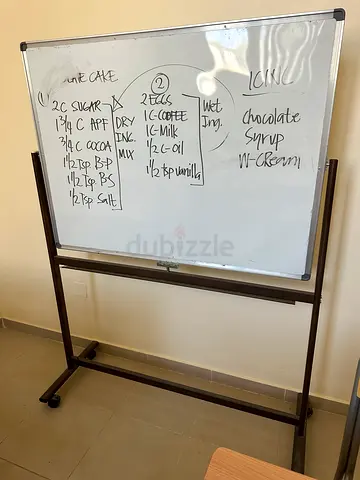Mobile double-sided whiteboard on wheeled stand - used