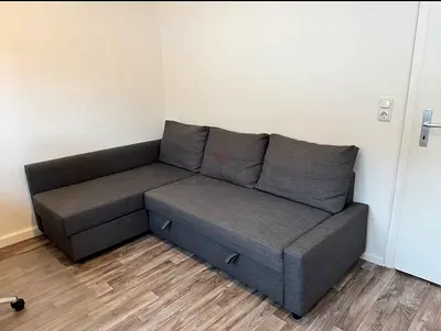 Grey L-shaped Sofa Bed with Storage — Good Condition