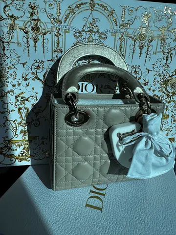 Light beige Lady Dior small handbag with charm