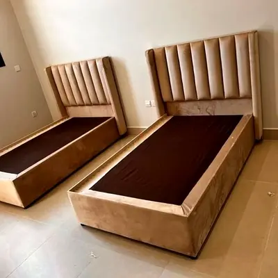Pair of upholstered single beds with tall channel-tufted headboards - beige