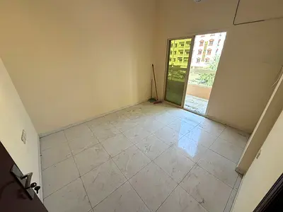 Two-bedroom apartment with a living room, balcony, and two bathrooms. Reasonably priced and located in a prime area with easy access to Dubai and Shar