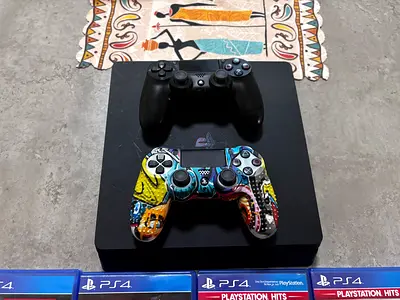 PS4 with 2 controllers and 4 games
