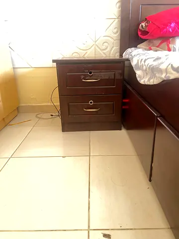 Used wooden bedside nightstand with two drawers - dark brown