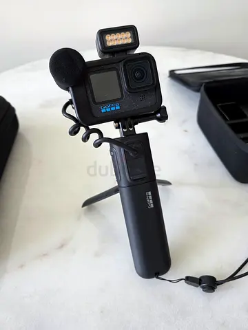 GoPro HERO action camera with microphone, light and handheld grip