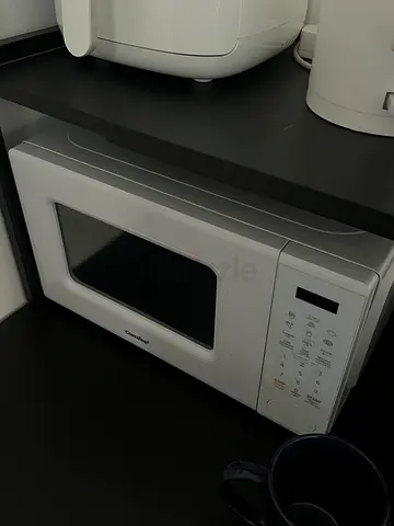 Compact white countertop microwave - good working condition