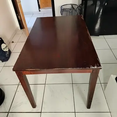 Used solid wood dining table - shows wear, sturdy frame