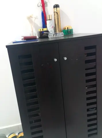 Small black storage cabinet  or shoe rack with side chair- good condition