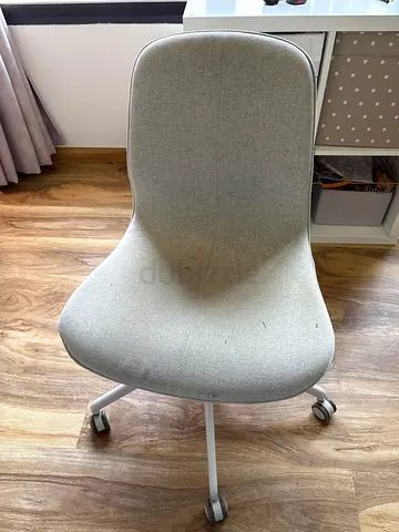 Light grey ergonomic office chair on wheels