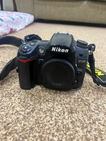 Nikon D7000 DSLR body with strap - used