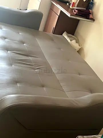 Grey faux leather sofa bed - good condition