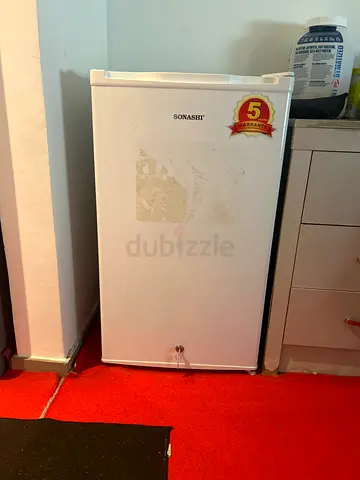 Small white single-door mini fridge - good working condition