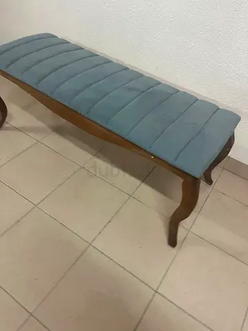 upholstered bench with a wooden frame