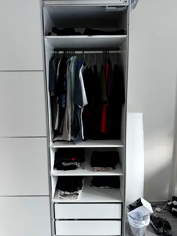 White wardrobe/armoire with multiple compartments — good condition